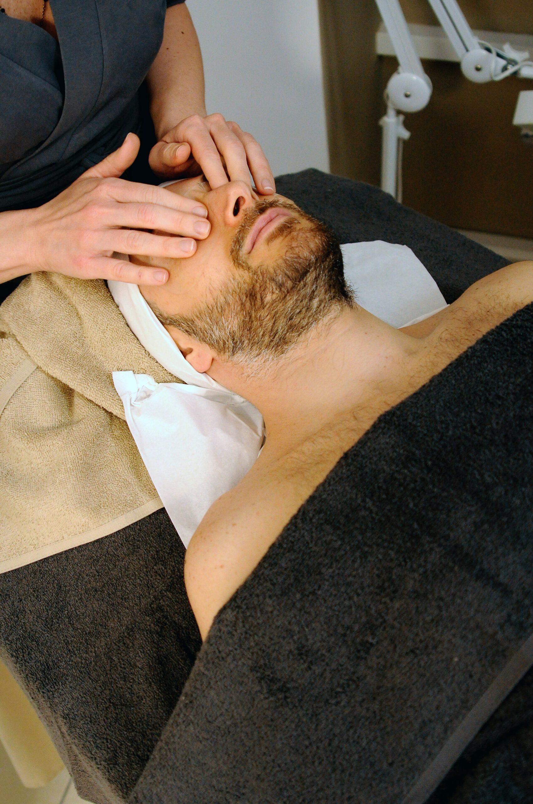 sleeping man while having massage